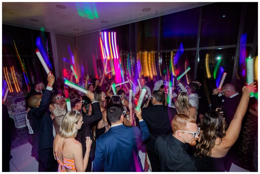 The Ray Hotel Wedding dance party with glow sticks and sunglasses