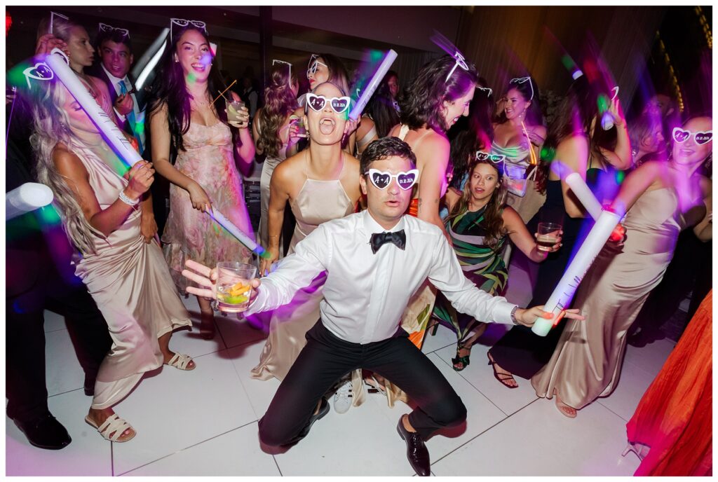 The Ray Hotel Wedding dance party with glow sticks and sunglasses