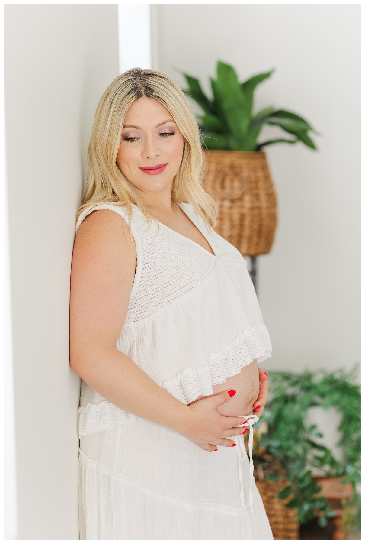 Hannah posing for her studio maternity photo shoot at The Rich Hippies House