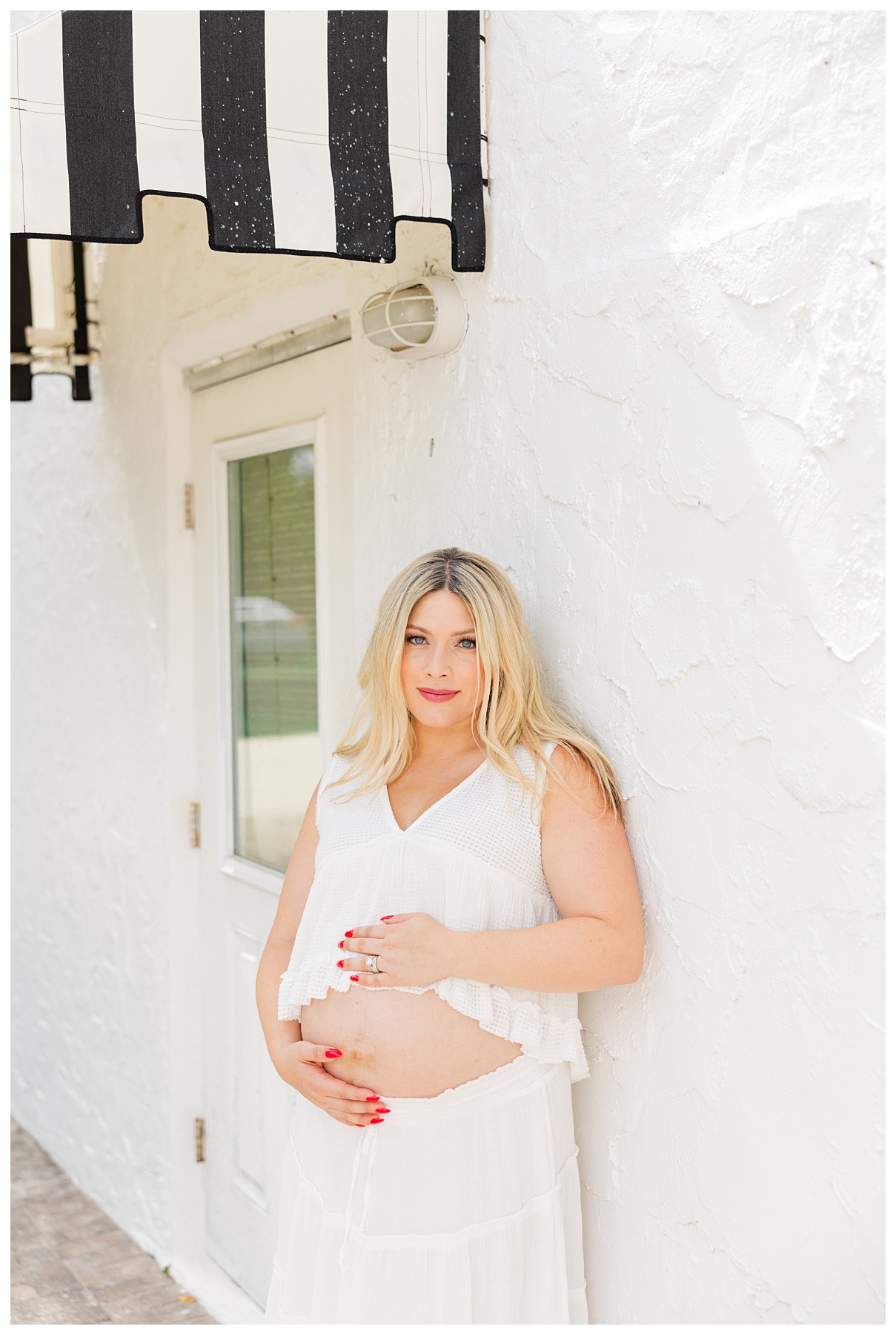 Hannah and Andrew pose   for their studio maternity photo shoot at The Rich Hippies House