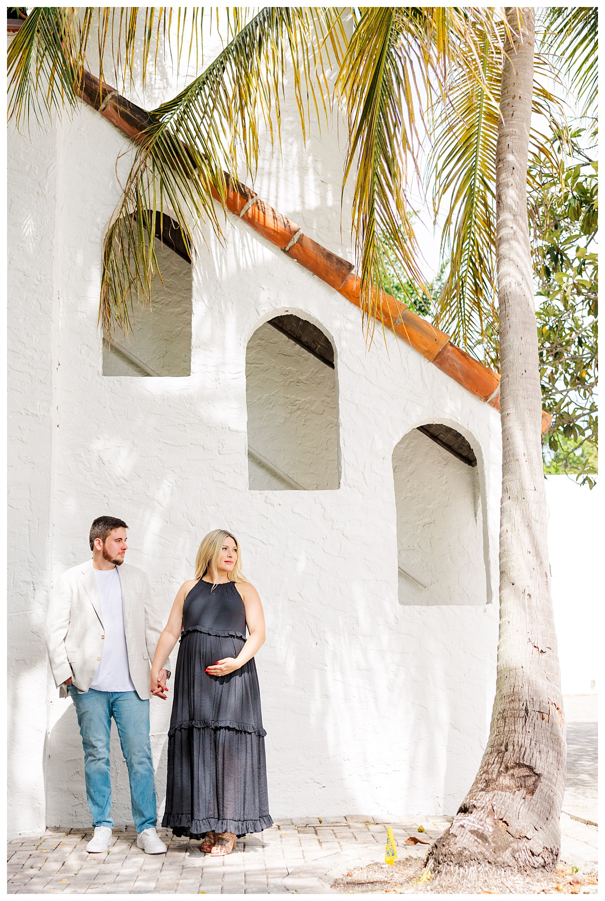 Hannah and Andrew pose   for their studio maternity photo shoot at The Rich Hippies House