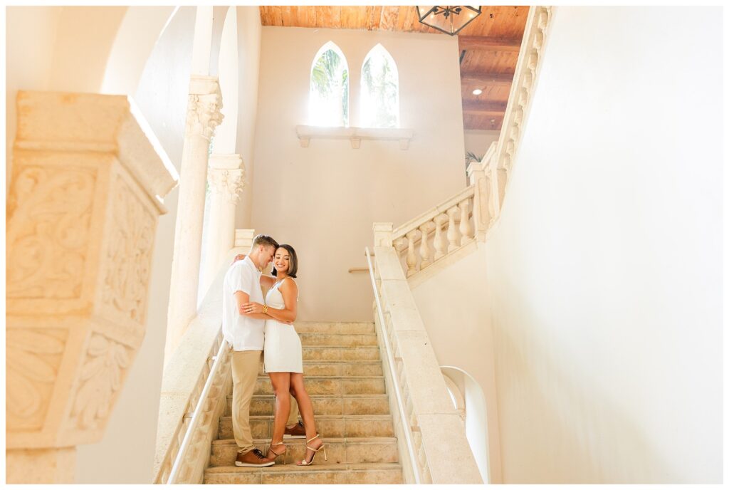 A couple poses for their engagement photos at The Boca Raton resort 