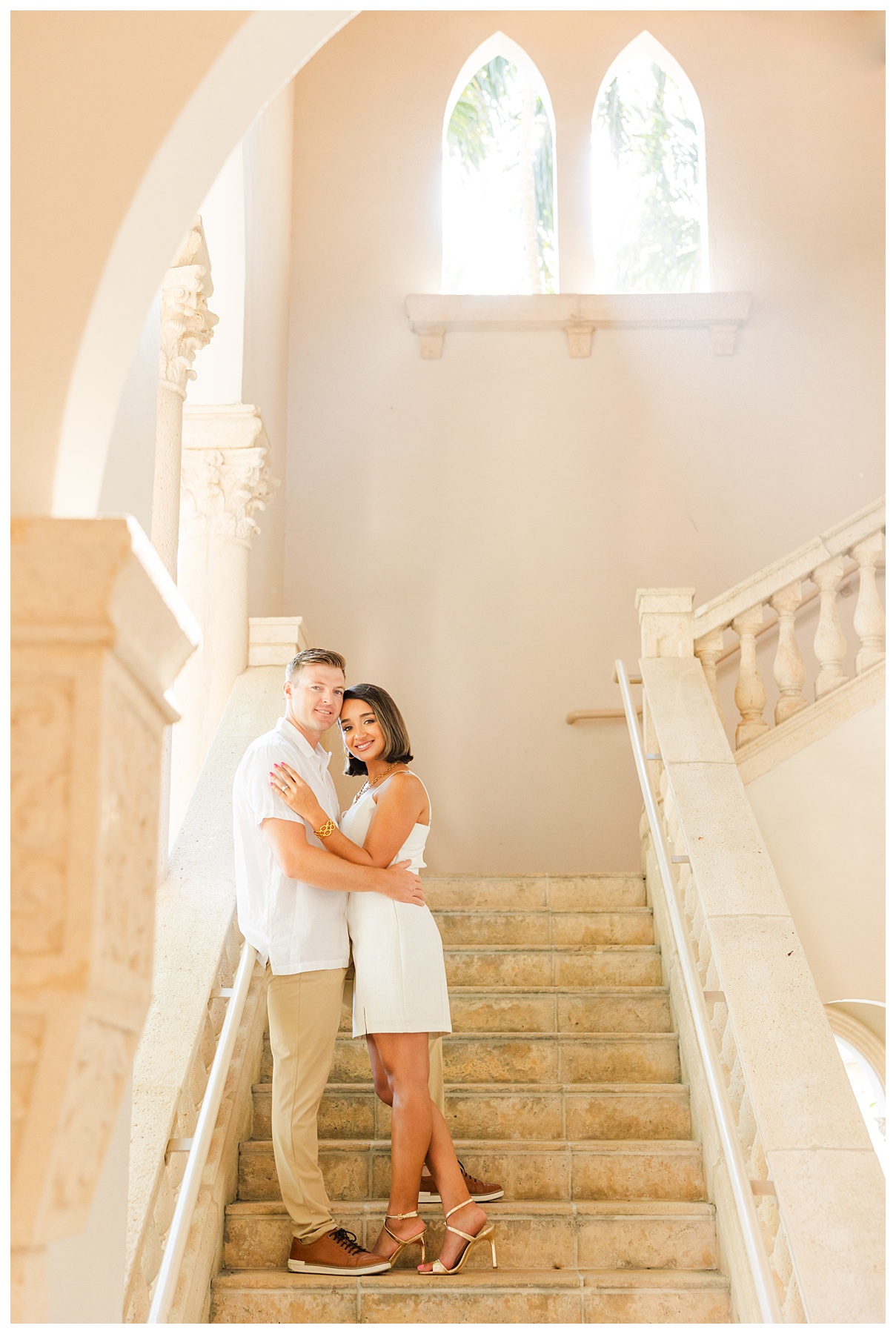 A couple poses for their engagement photos at The Boca Raton resort 