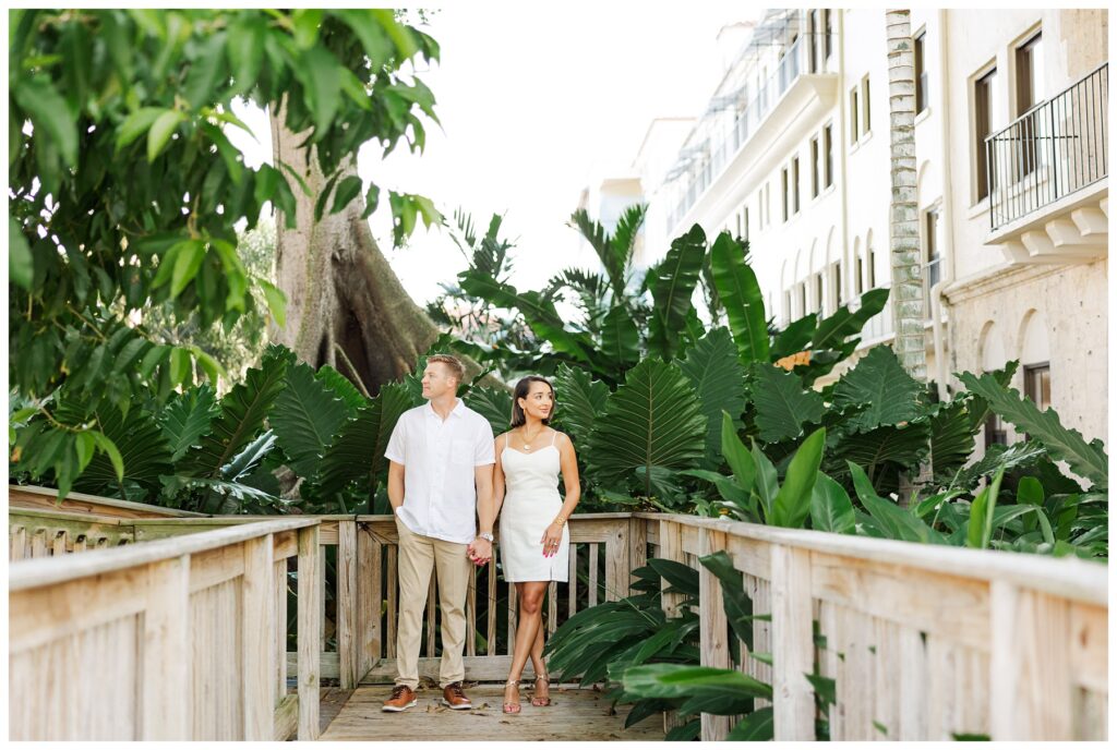 A couple poses for their engagement photos at The Boca Raton resort 