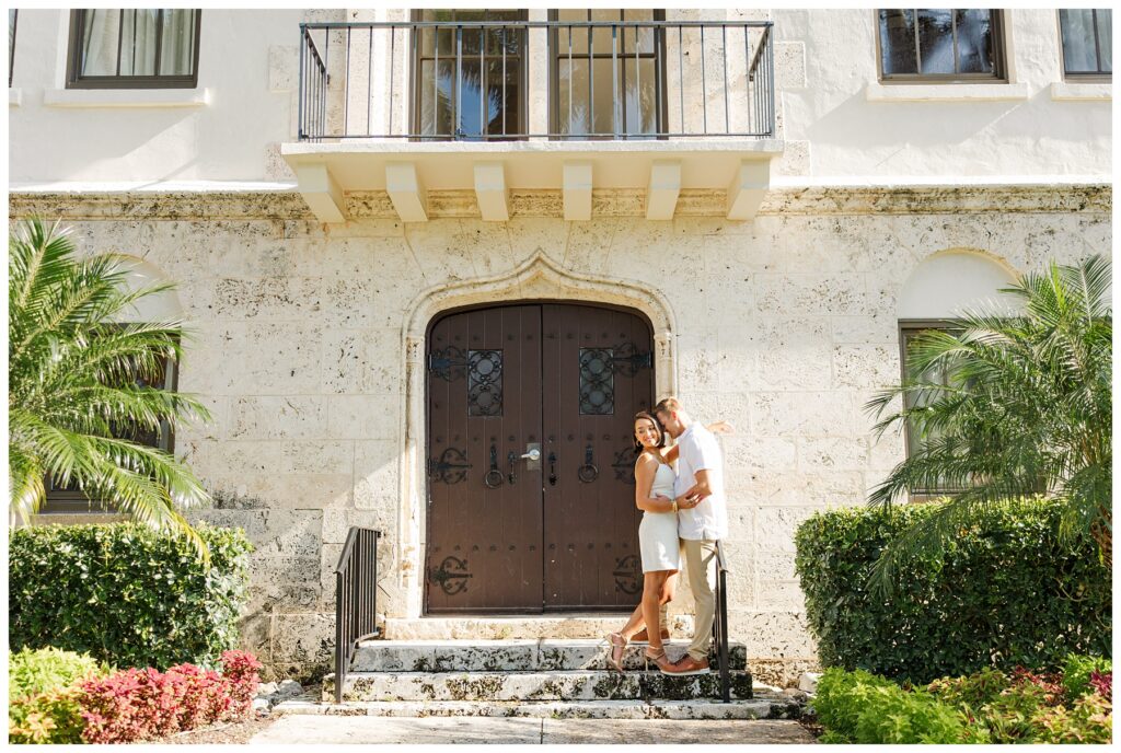 A couple poses for their engagement photos at The Boca Raton resort 