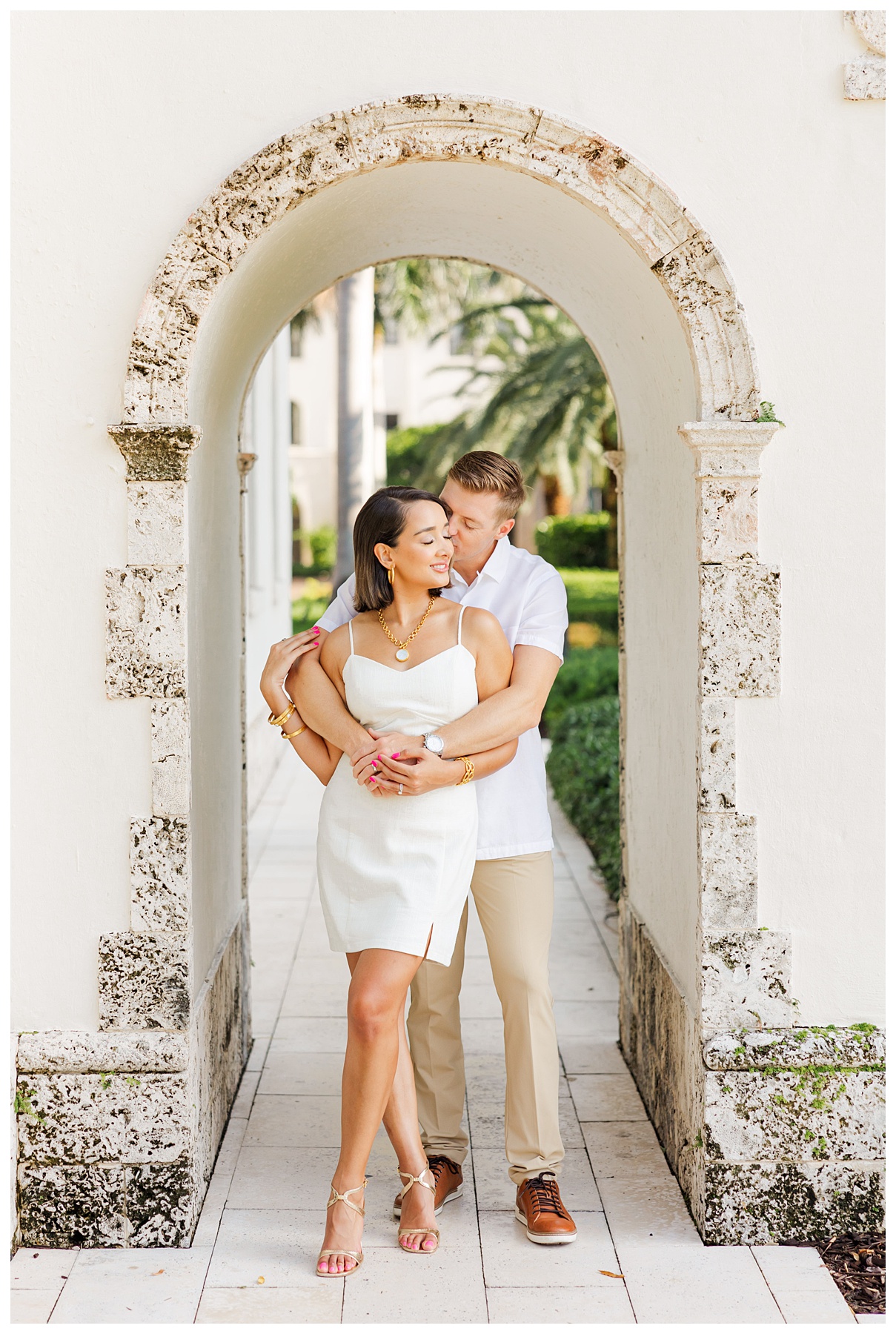 A couple poses for their engagement photos at The Boca Raton resort 