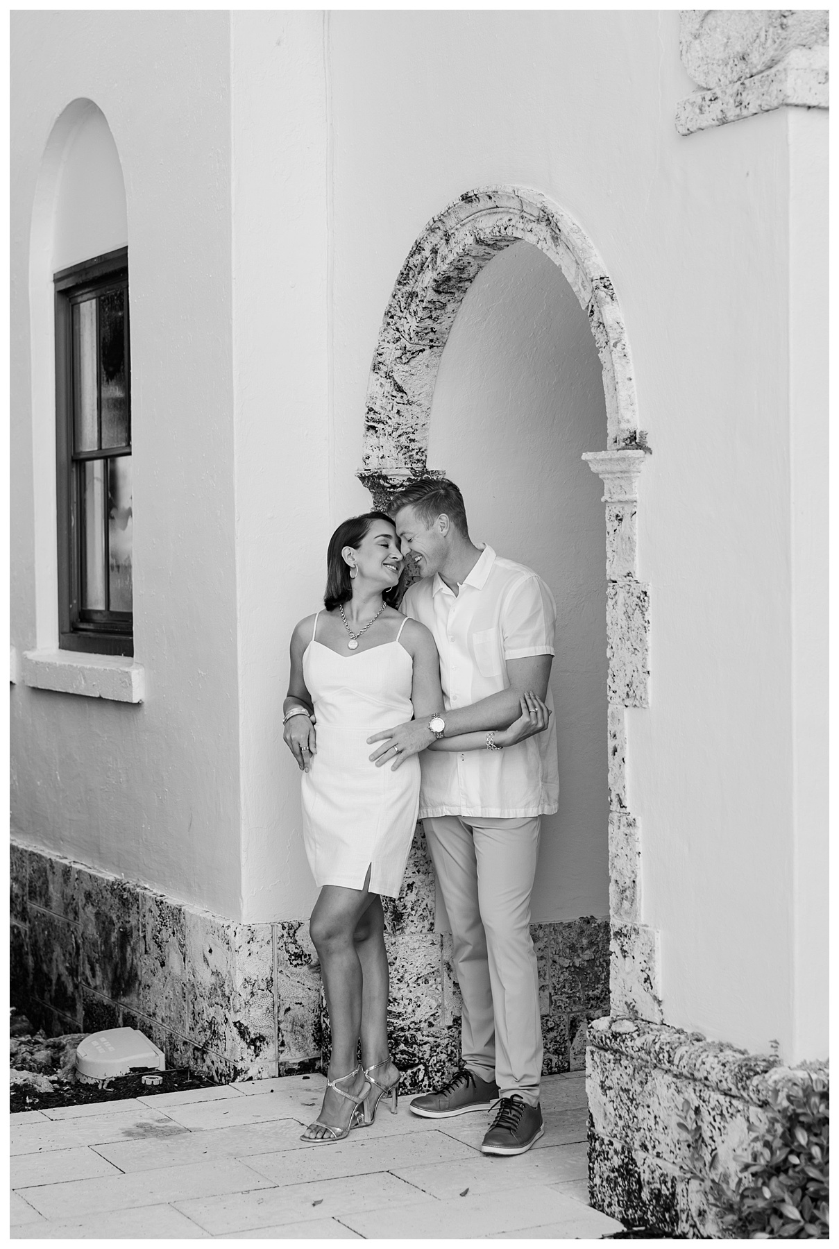 A couple poses in black and white for their engagement photos at The Boca Raton resort 