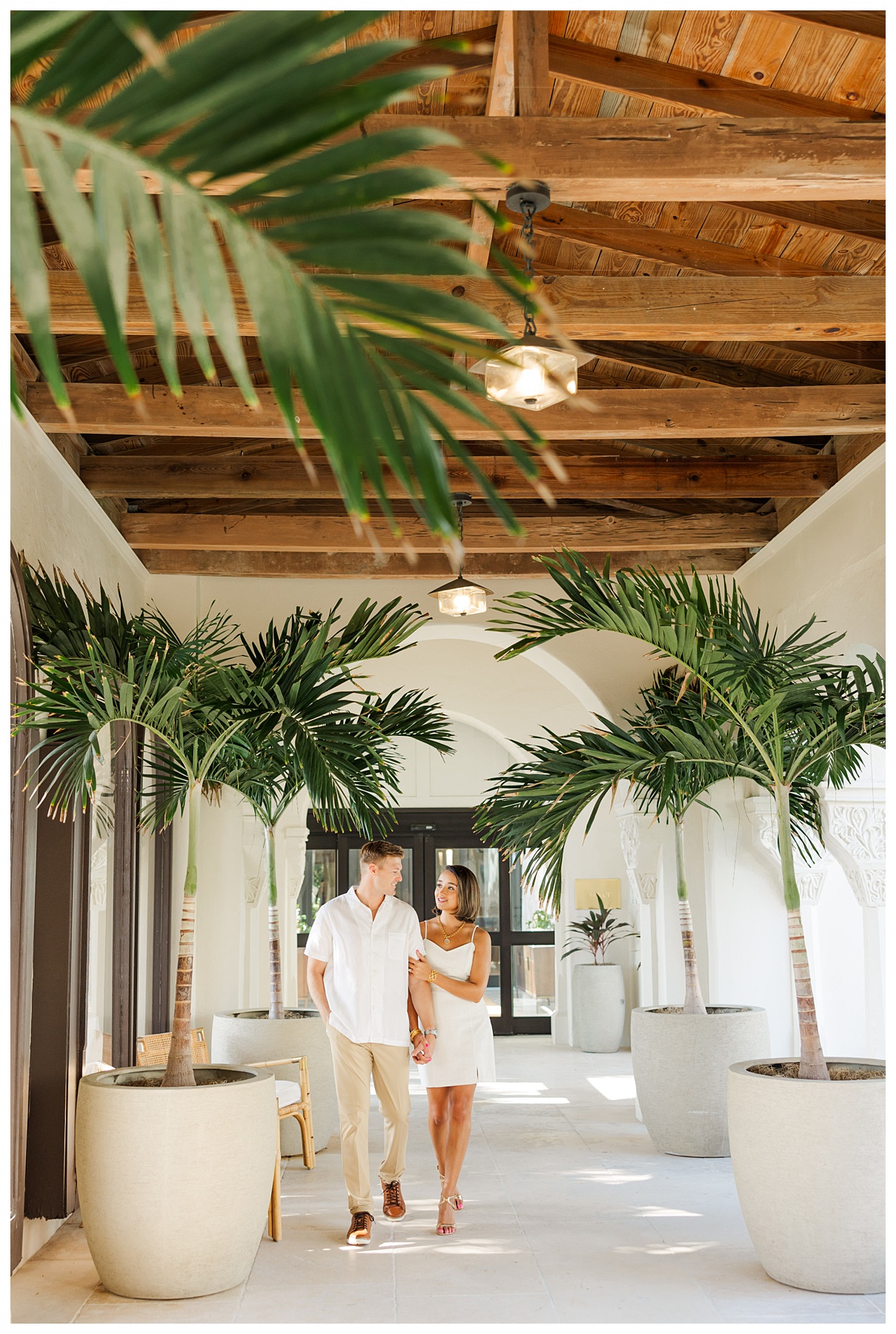 A couple poses for their engagement photos at The Boca Raton resort 