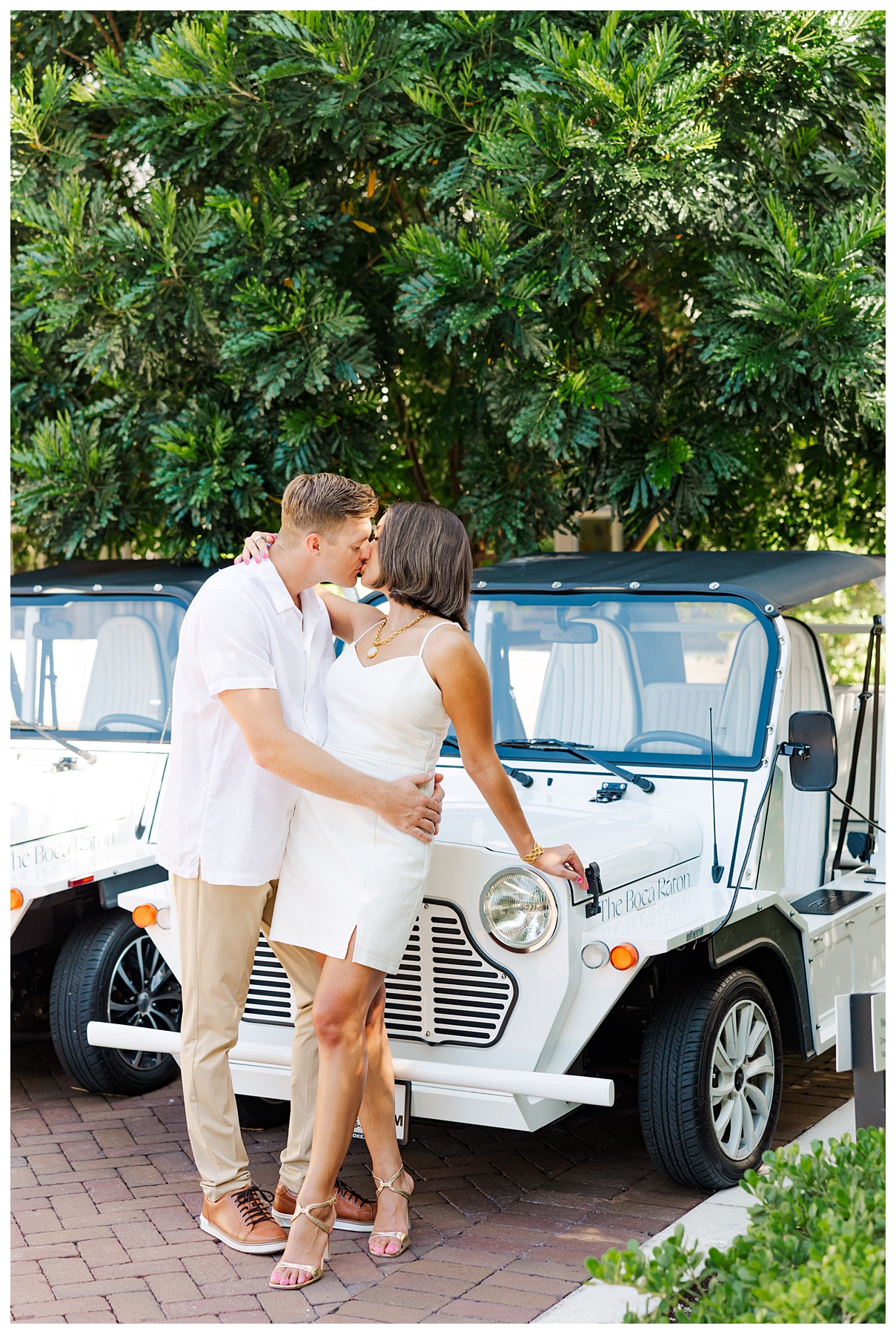 A couple poses for their engagement photos at The Boca Raton resort 