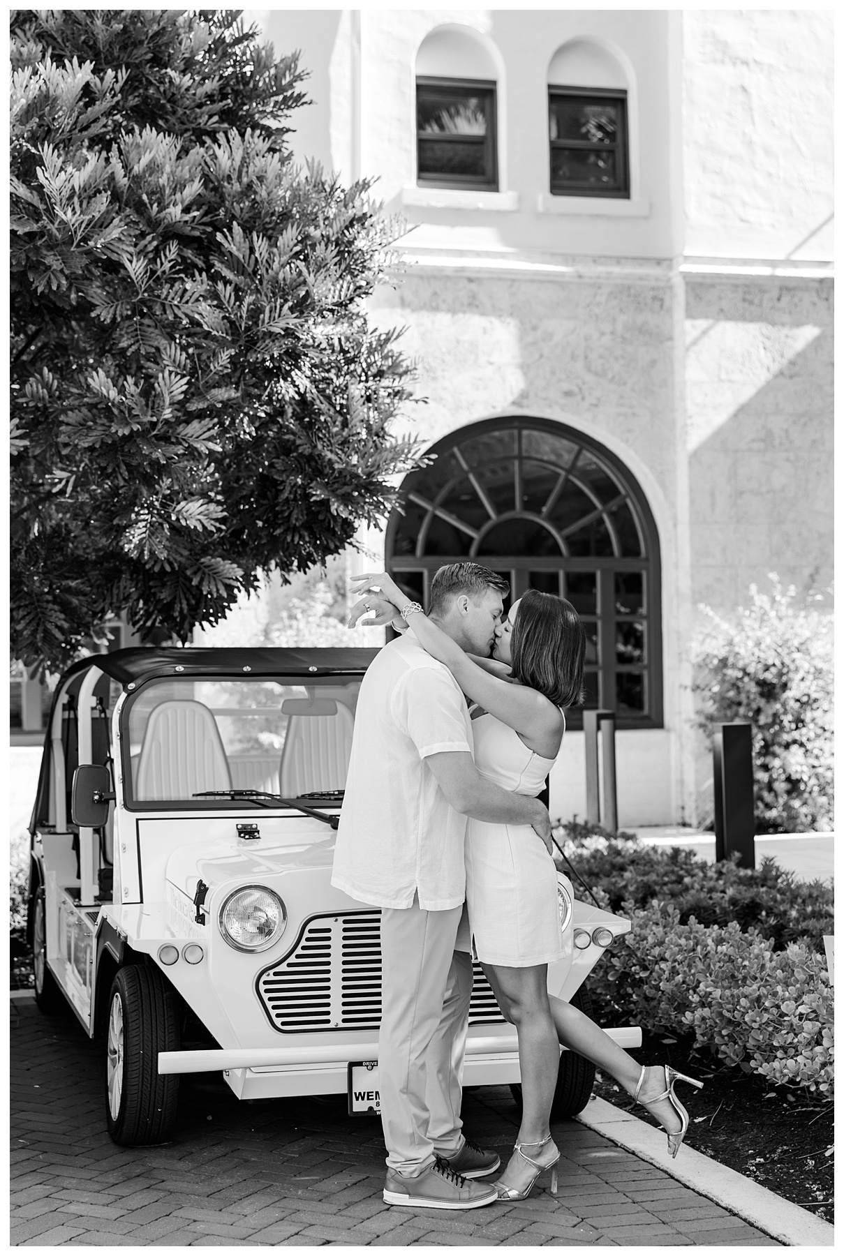 A couple poses for their engagement photos at The Boca Raton resort 