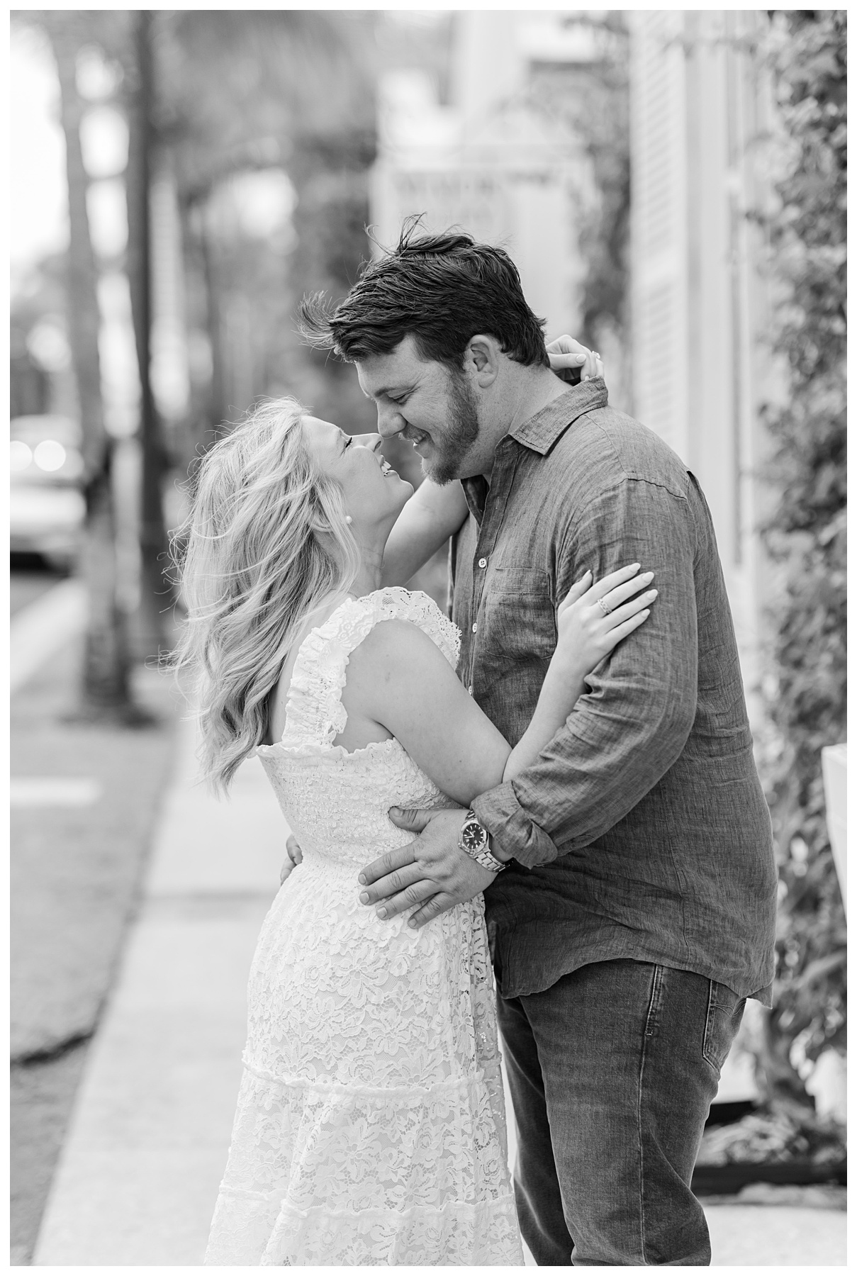 a black and white timeless image of the engaged couple looking in each others eyes for their Palm Beach engagement photos