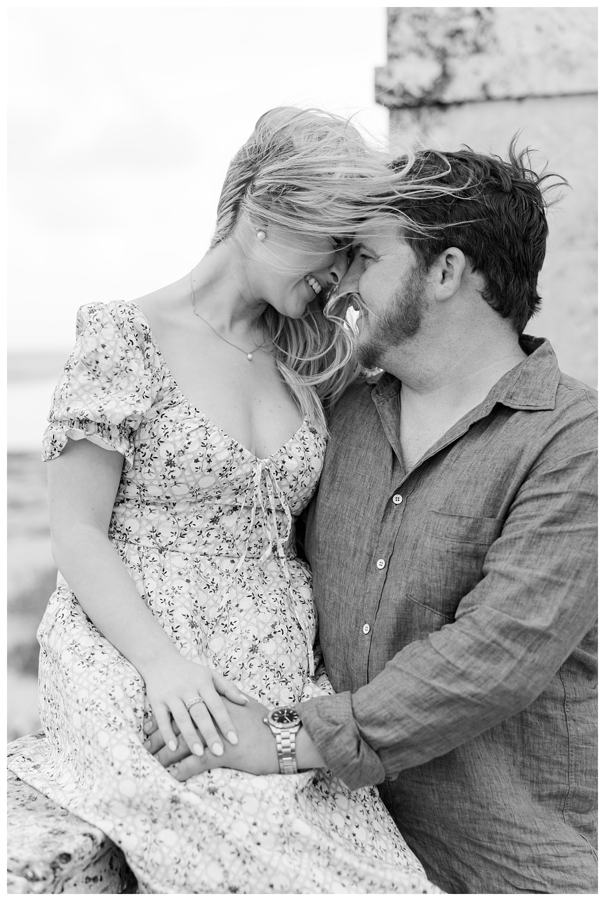 a wind swept photo of the bride and groom at the Worth Ave Clock Tower on Palm Beach Island