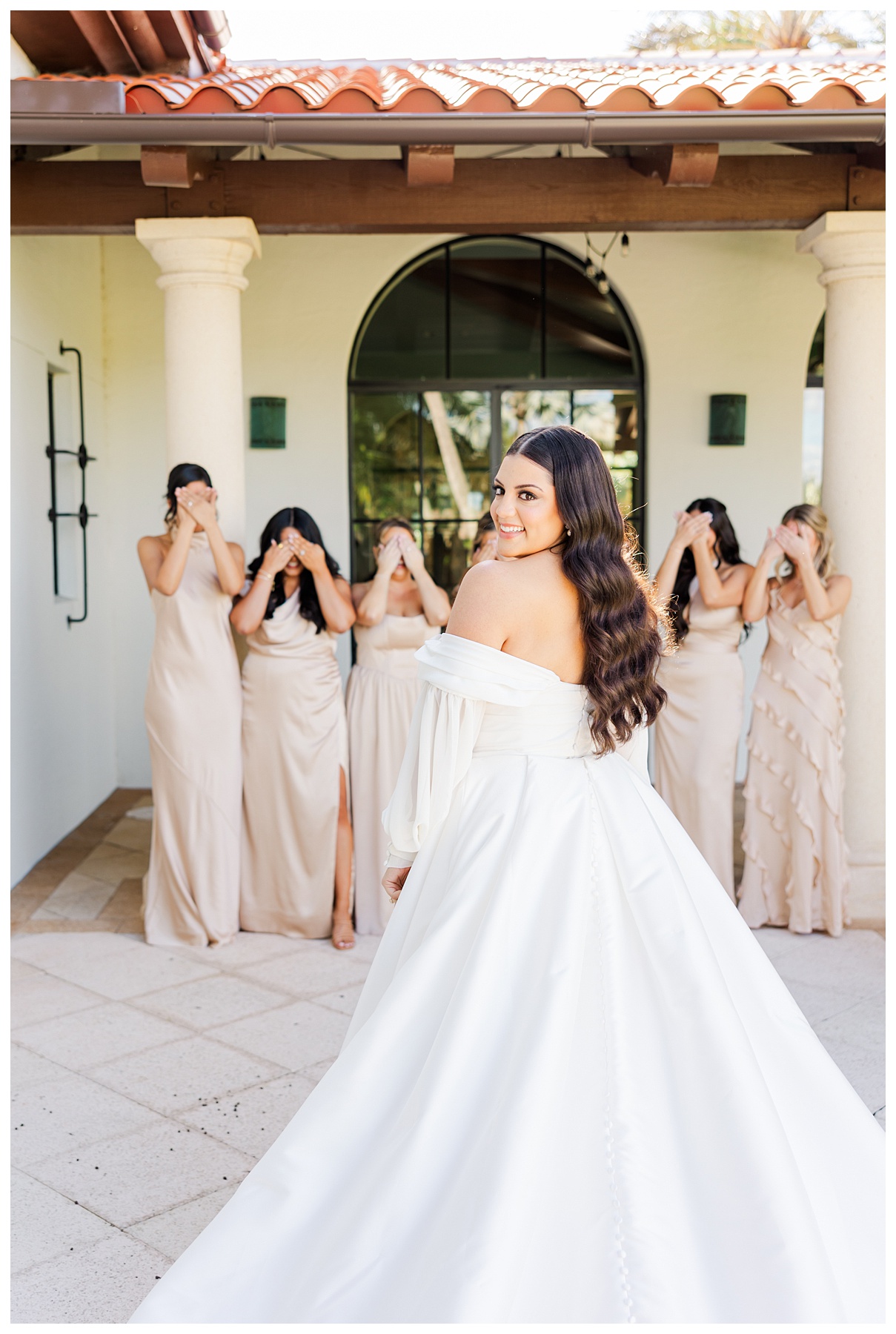 Bride first look with her bridesmaids before her wedding at The Parkland Golf & Country Club