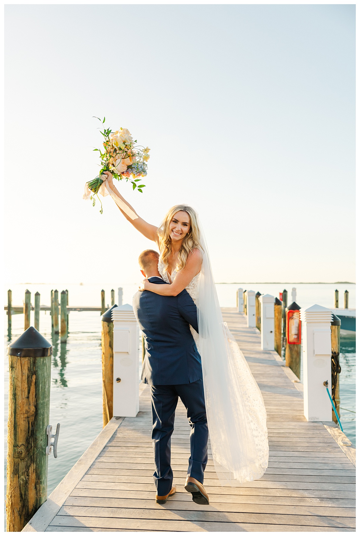 Playa Largo Wedding Bride and Groom playful Sunset Portraits on the dock