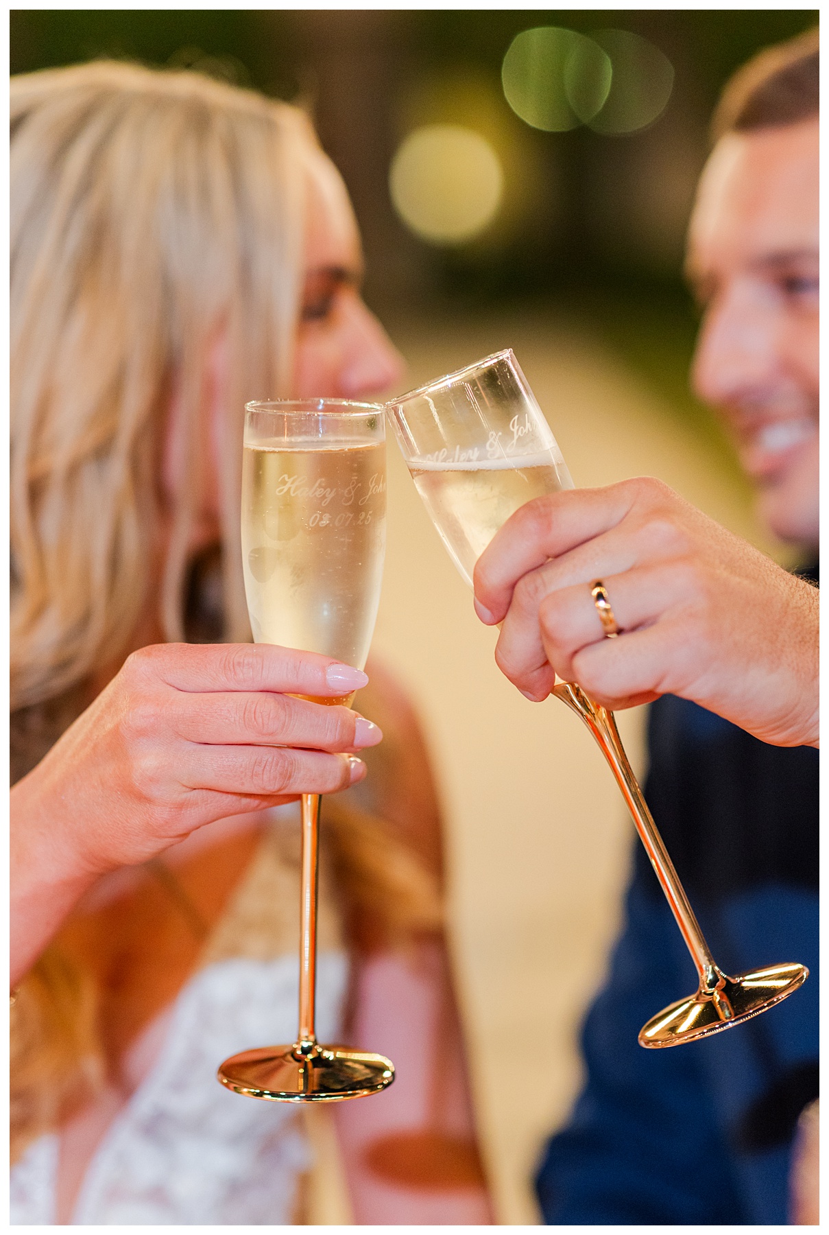 Bride and Groom champagne toast at wedding reception