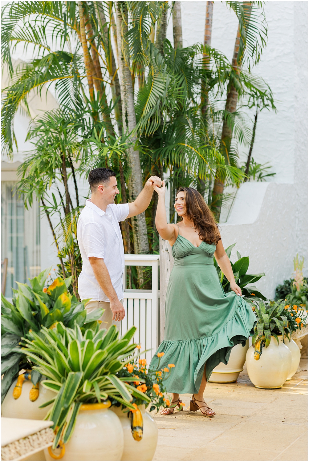 Newly engaged couple twirl on Worth Avenue for their engagement photos
