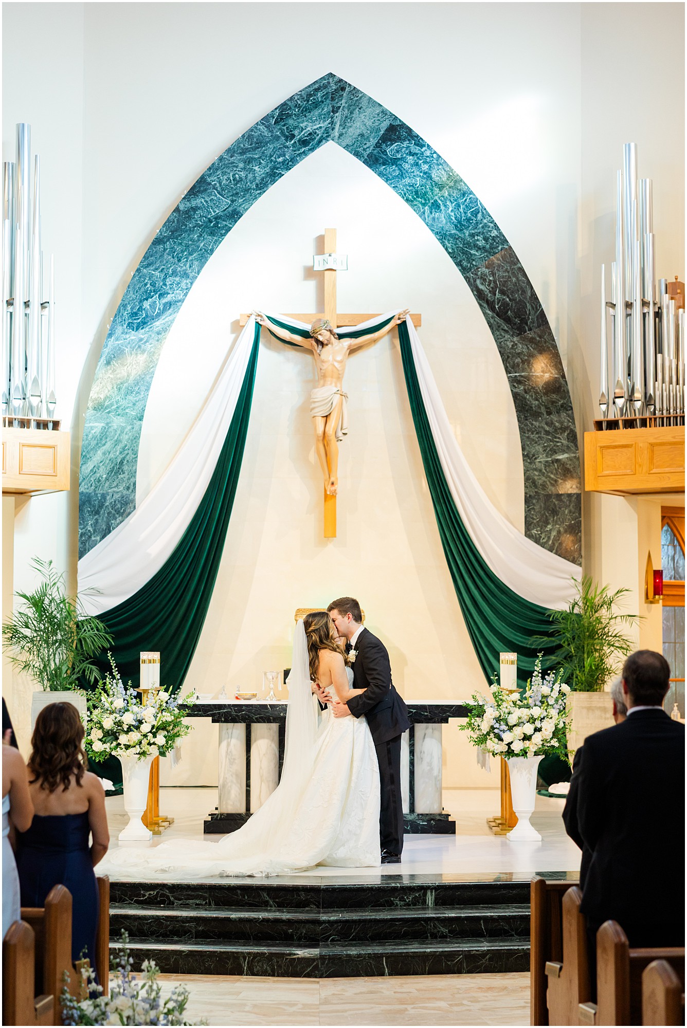 bride and groom first kiss