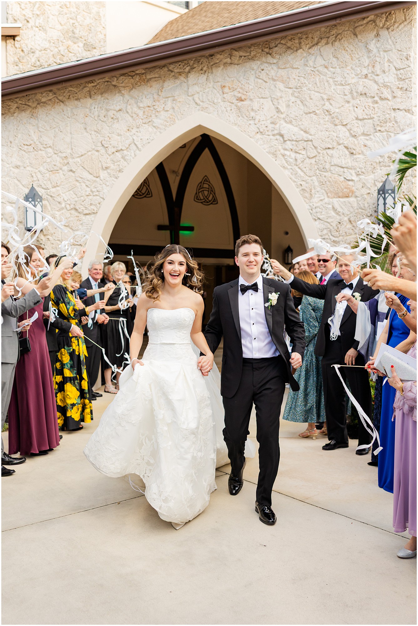 bride and groom ribbon send off from the church