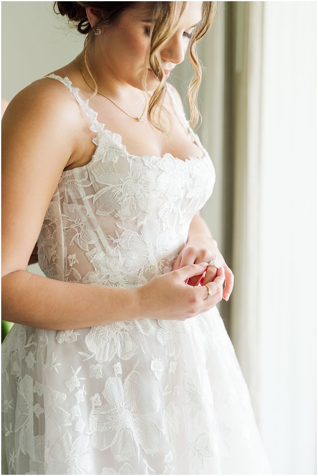 Key Largo Wedding Photographer captures bride looking at her wedding band while getting ready