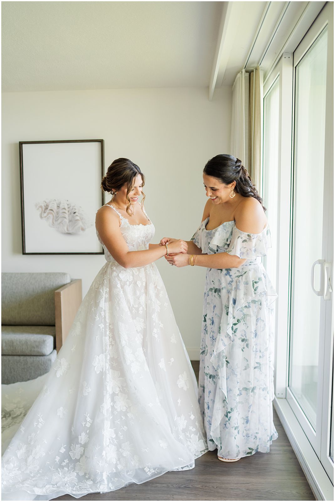 bride getting into dress on wedding day