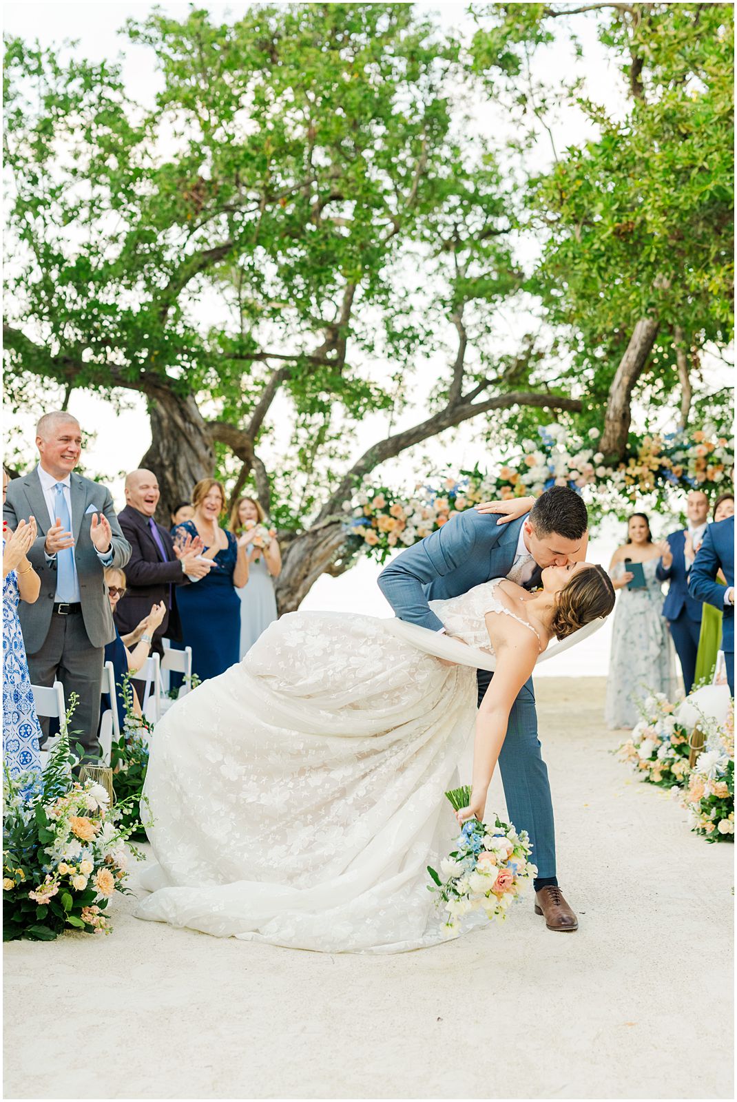Key Largo Wedding Photographer captures bride and groom kiss down the aisle at Baker's Cay